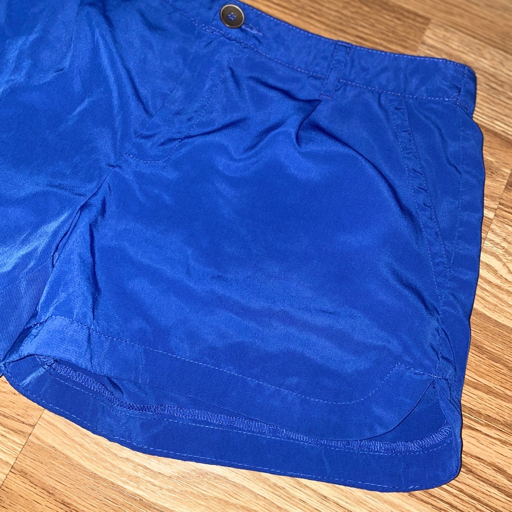 Silk blue shorts w/pockets and belt loops.